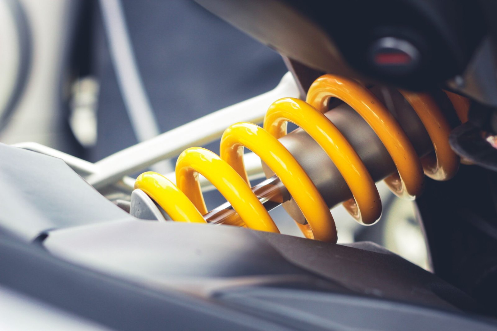 Mechanic inspecting car suspension and shocks in Fort Worth, TX