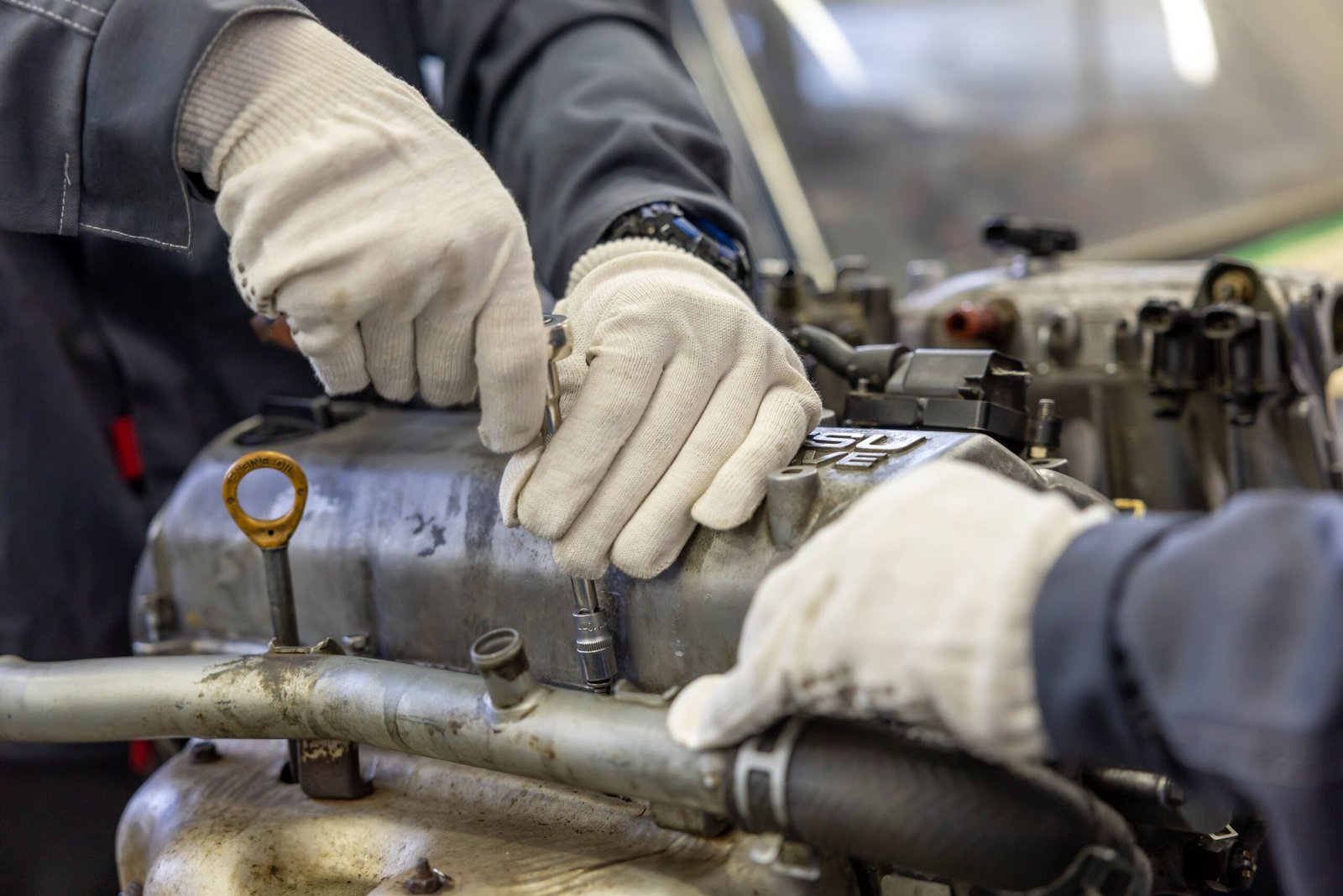 Mechanic performing a transmission rebuild at Payless Transmissions in Fort Worth, TX